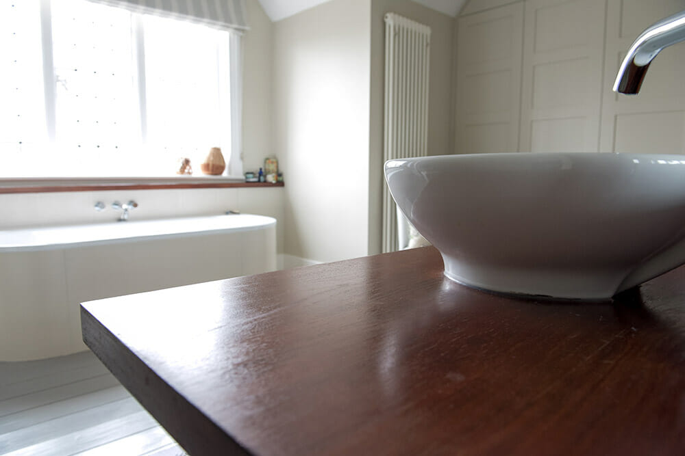 bathroom-sink-on-wooden-worktop